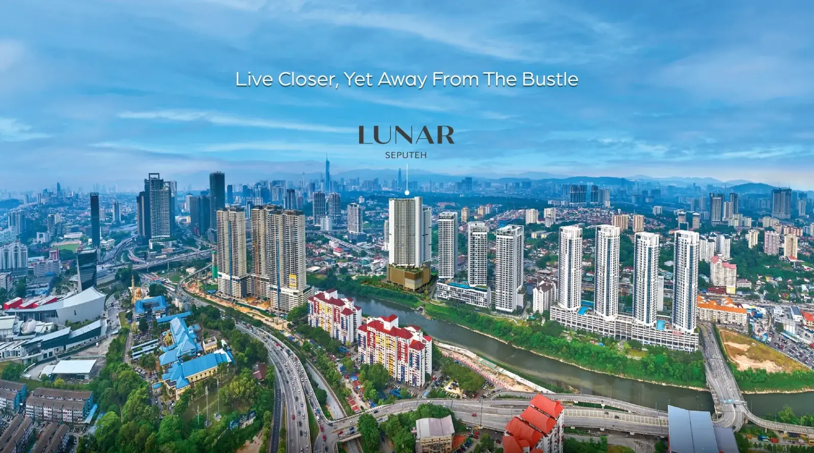 Aerial view of Lunar Seputeh pinpointed within 9 Seputeh beside the river, against the KL skyline
